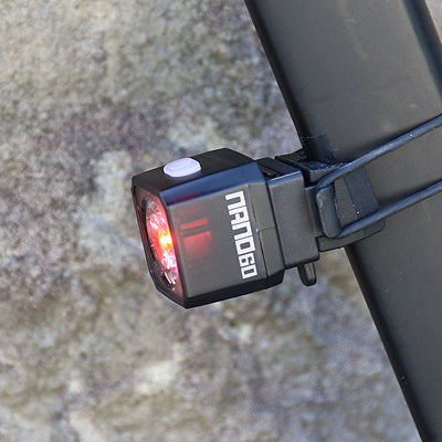 cateye nano 60, small square rear bike light, black cube bike light, close up of light 