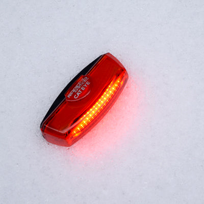 Red Cateye Rapid X2 kinetic rear LED light on a white background