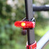 CatEye Ampp 400s / Viz 100 II Bike Light Set, red light turned on at rear of bike under saddle 