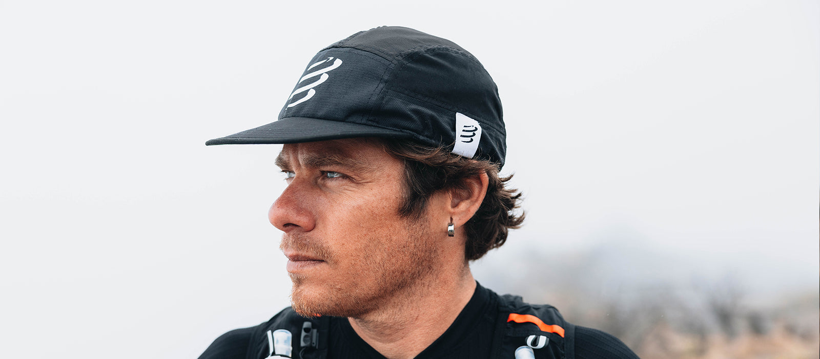 black compressport running cap on model outside
