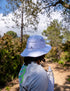 compressport stayfresh ice bob hat, white running bucket hat with ventilation and sun protection, man wearing hat from behind