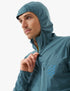 compressport tempest waterproof jacket, breathable and waterproof running jacket, deep aqua blue colour, man with hood zipped