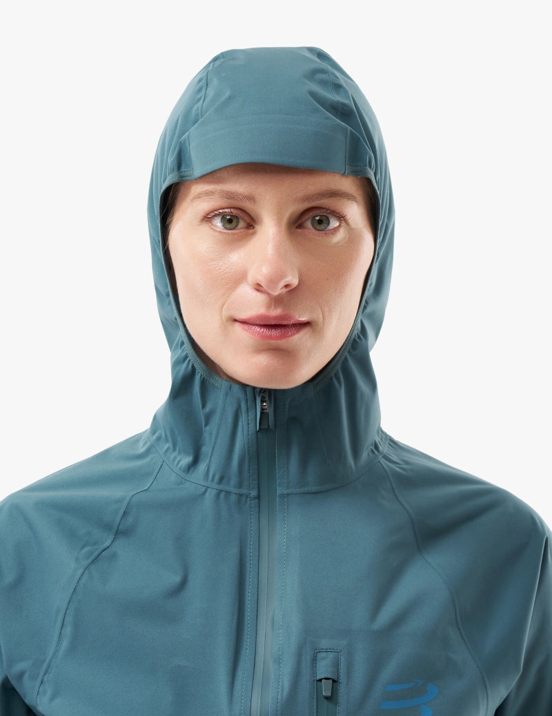compressport tempest waterproof jacket for women, lightweight breathable and packable, dark aqua blue colour, up close of hood