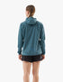 compressport tempest waterproof jacket for women, lightweight breathable and packable, dark aqua blue colour, back of jacket on model