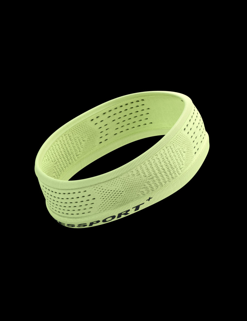 Thin sports headband from compressport, in lime