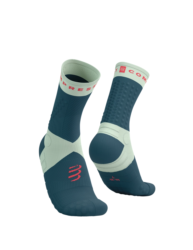 Pair of compressport ultra trail socks blue and teal socks with brand logo on a white background