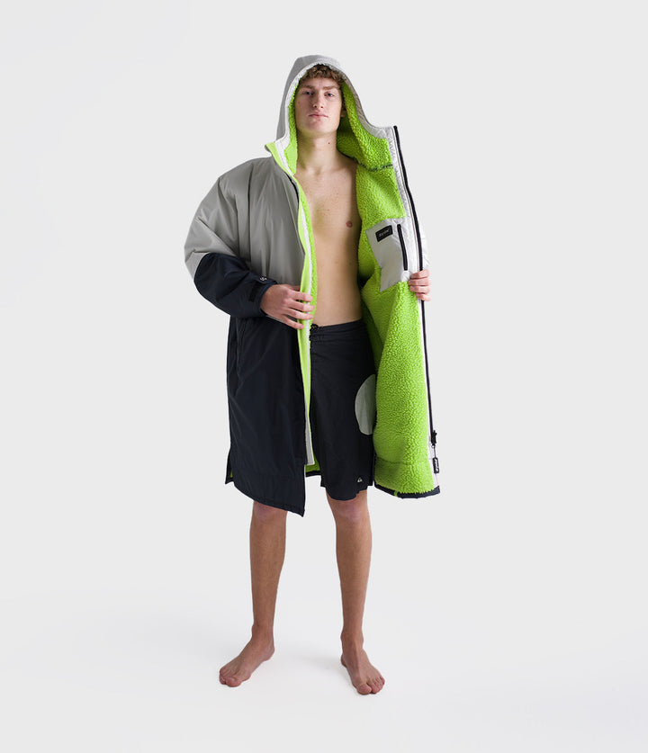 dryrobe long sleeve changing robe for all gender, light grey and navy colour with lime green interior, man wearing dryrobe zipped down