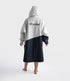 dryrobe long sleeve changing robe for all gender, light grey and navy colour with lime green interior, woman wearing dryrobe, view of back