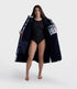 dryrobe long sleeve changing robe for all gender, light blue tie dye colour with dark blue contrast, man wearing dryrobe zipped down, displaying dark blue interior