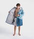 dryrobe long sleeve changing robe for all gender, light blue colour with dark blue contrast, man wearing dryrobe zipped open, displaying light grey interior