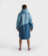 dryrobe long sleeve changing robe for all gender, light blue colour with dark blue contrast, man wearing dryrobe zipped up displaying back of dryrobe