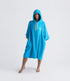 dryrobe organic cotton changing robe for swimming, soft and absorbent towelling robe for all gender, blue colour, woman wearing dryrobe towel on a white background