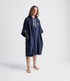 dryrobe organic cotton changing robe for swimming, soft and absorbent towelling robe for all gender, navy colour, man wearing dryrobe towel on a white background