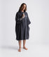 dryrobe organic cotton changing robe for swimming, soft and absorbent towelling robe for all gender, dark grey colour, man wearing dryrobe towel on a white background