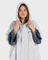 dryrobe towel robe for men and women, full zip towel robe for after swimming, light grey white colour with grey sleeve caps, woman wearing dryrobe with hood up 