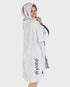dryrobe towel robe for men and women, full zip towel robe for after swimming, light grey white colour with grey sleeve caps, woman wearing dry robe side profile with dark grey logo