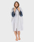 dryrobe towel robe for men and women, full zip towel robe for after swimming, light grey white colour with grey sleeve caps, 
woman wearing light grey zipped up dryrobe with hood up