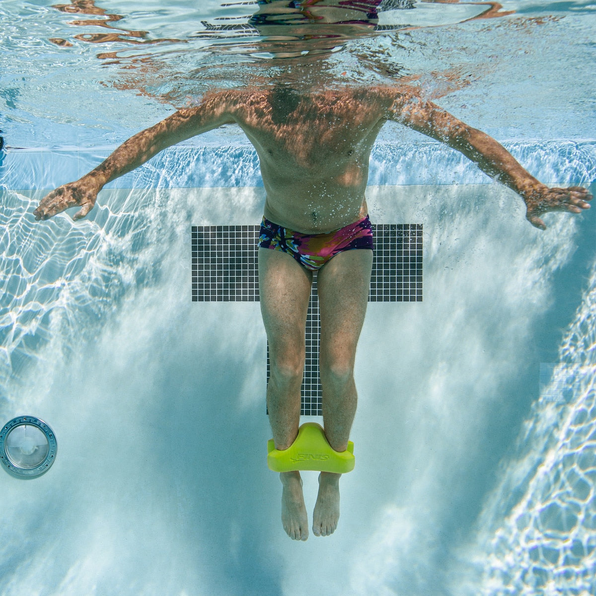 man swim training with finis ankle buoy