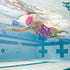 woman swim training with finis pull buoy
