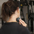 woman using fitness mad latex free pinpoint trigger ball on her neck
