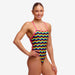 woman wearing funkita strapped in swimsuit in rainbowie pattern