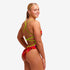 woman wearing funkita saucy sonar pattern in the strapped in swimsuit style