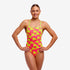 Funkita tie me tight swim suit, woman wearing sweet coconuts pattern in pink and yellow