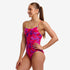 funkita womans one piece diamond back swim suit, period proof swim suit for women, pink geometric with lime strap detail, woman wearing swimsuit on white background