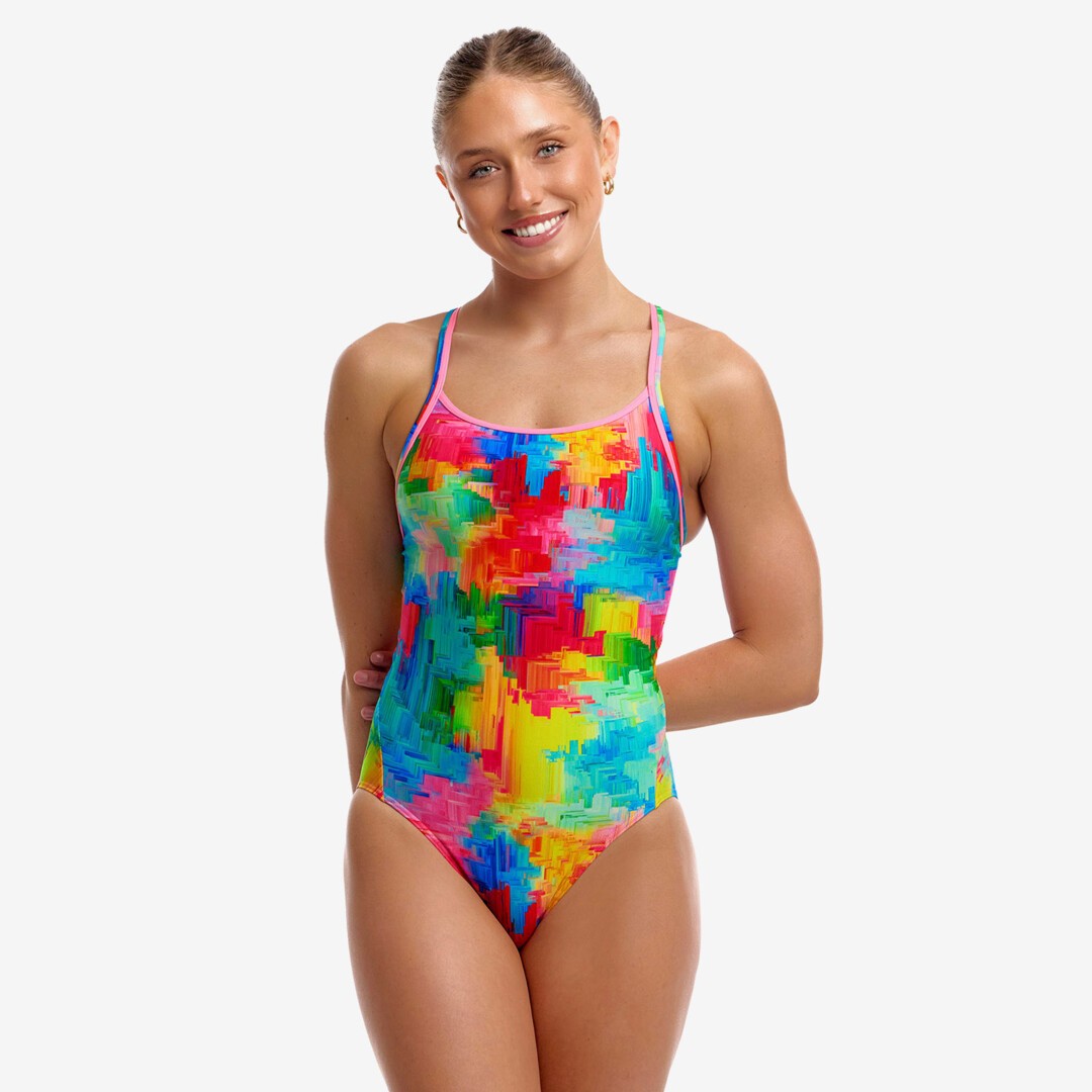 funkita womens one piece diamond back swimsuit,r ainbow painted  pattern with pink strap detail, woman wearing swim suit on white background