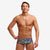 man wearing funky trunks classic trunks in bits of peace pattern