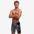 Boy wearing funky trunks jammer in bits of peace pattern