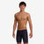 funky trunks boys jammers, boys swimming trunks, black with small white pattern, boy wearing swimming bottoms on white background