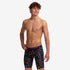 funky trunks boys jammers, boys swimming trunks, black with rainbow pattern, boy wearing swimming bottoms on white background