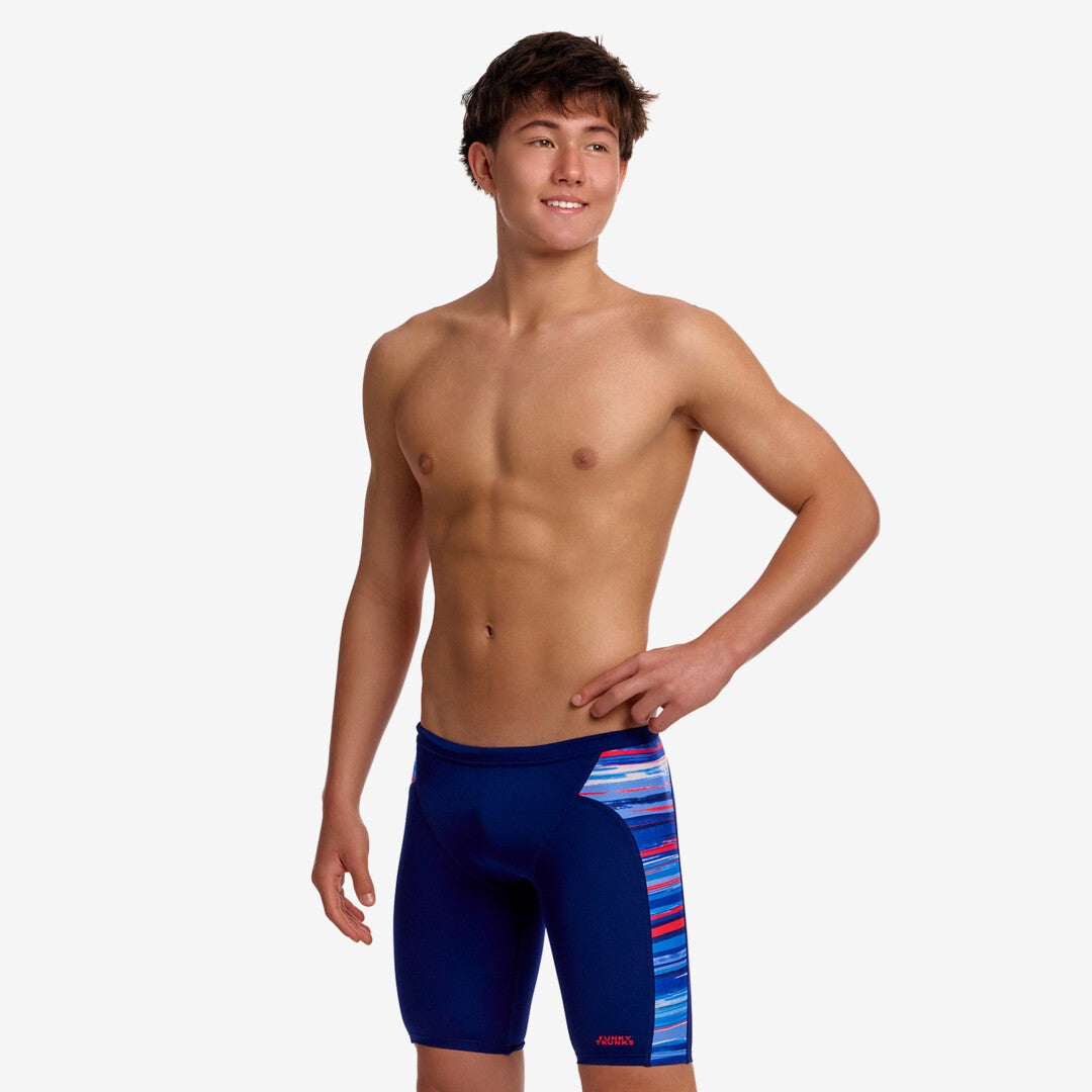 funky trunks boys jammers, boys swimming trunks, navy with blue and red side panel, boy wearing swimming bottoms on white background