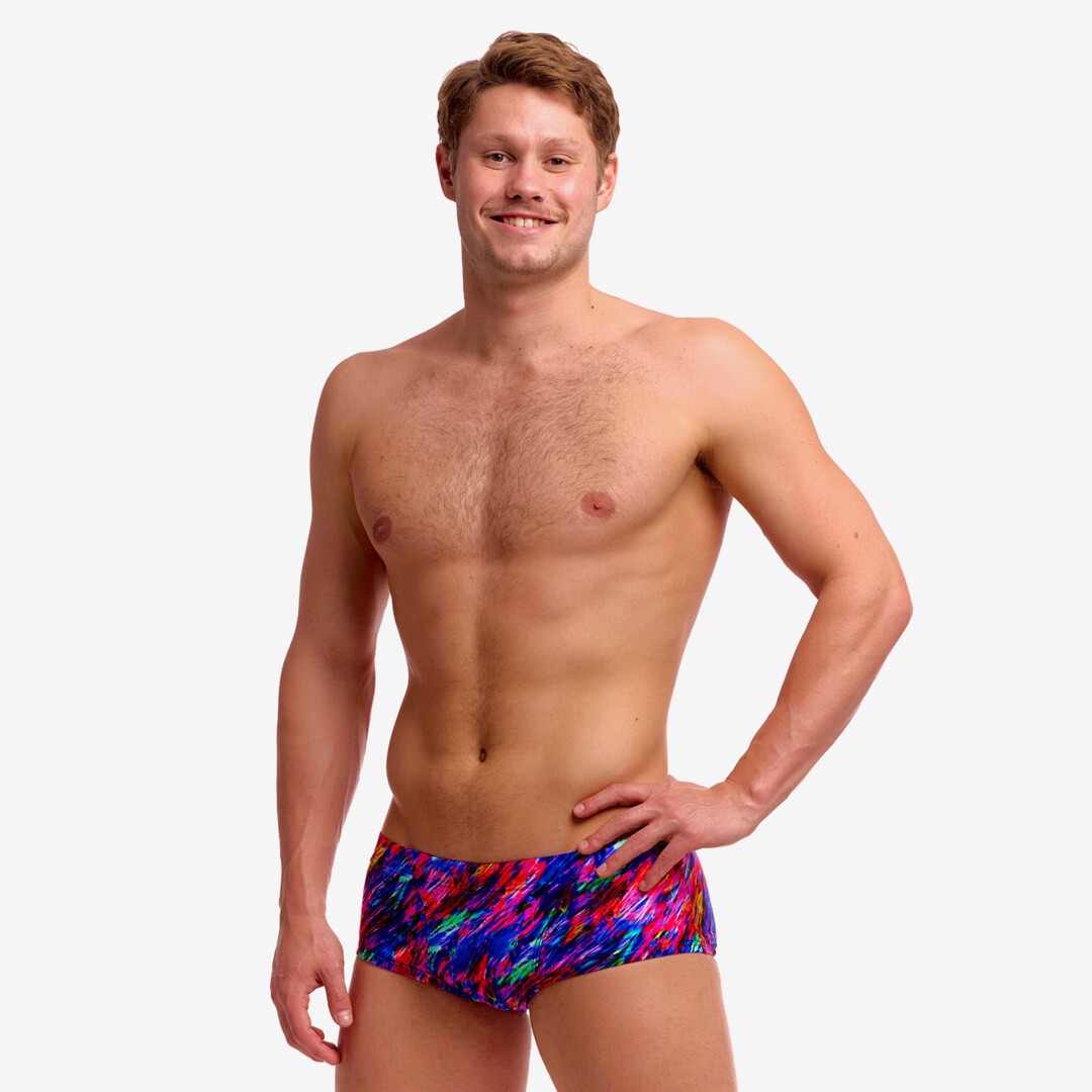 man wearing funky trunks classic trunks in big bang pattern