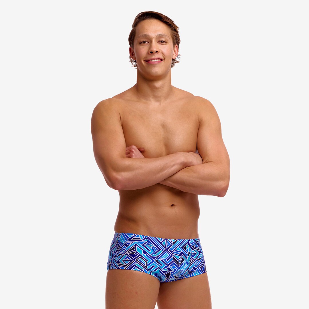 man wearing funky trunks classic trunks in blue bits pattern