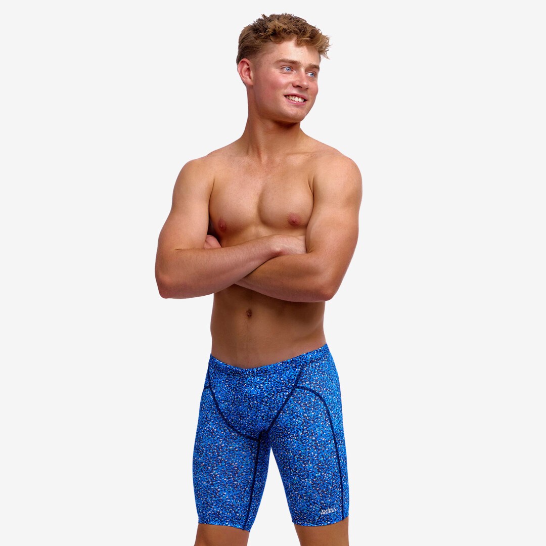 boy wearing funky trunks swim jammers in pebble beach pattern