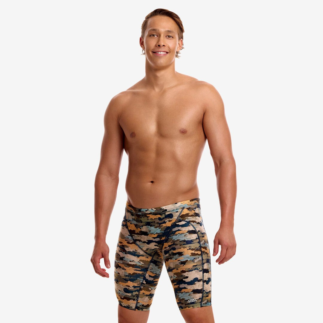 funky trunks jammers, mens tight swimming bottoms, brown camo colour, man standing in swim shorts with white background