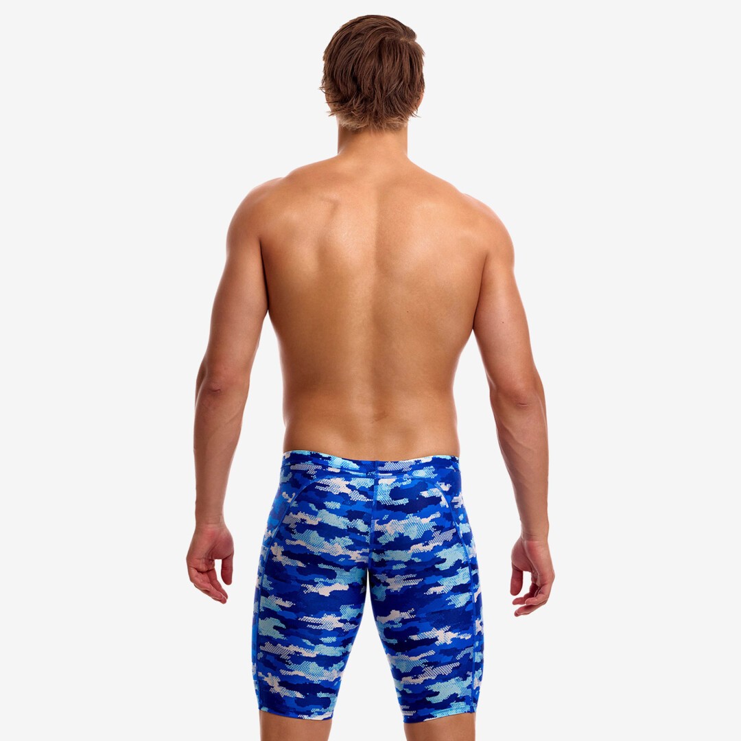 funky trunks jammers, mens tight swimming bottoms, brown camo colour, back of man standing in swim shorts with white background