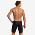 funky trunks mens jammers, tight swim shorts, black with small white pattern, back of man wearing swim bottoms on white background 