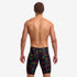funky trunks jammers, mens tight swimming bottoms, black colour with small rainbow pattern, back of man standing in swim shorts with white background