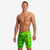 funky trunks jammers, mens tight swimming bottoms, bright green and yellow colour, man standing in swim shorts with white background