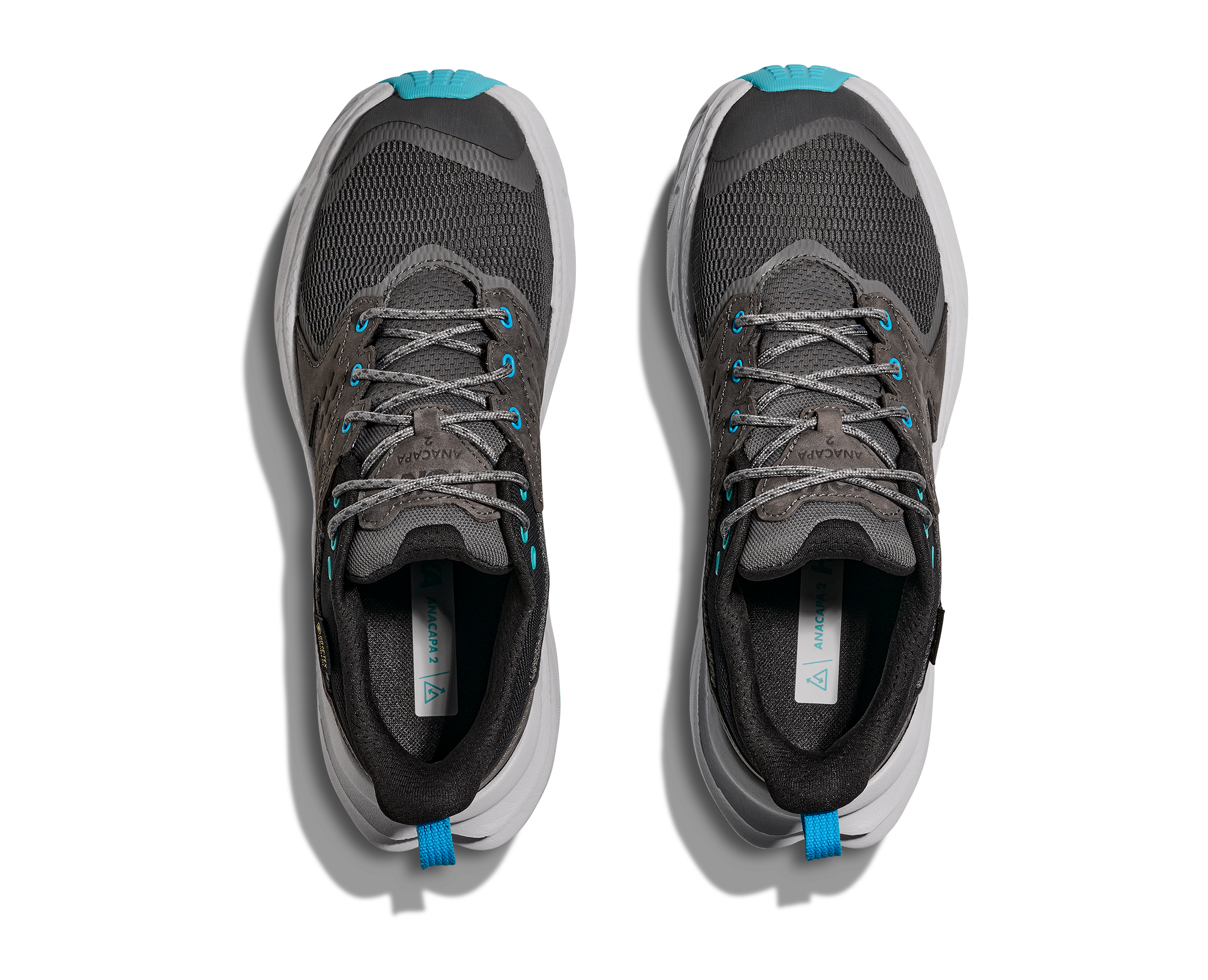 Pair of dark grey hoka waterproof womens hiking shoe with light grey and blue accents looking down
