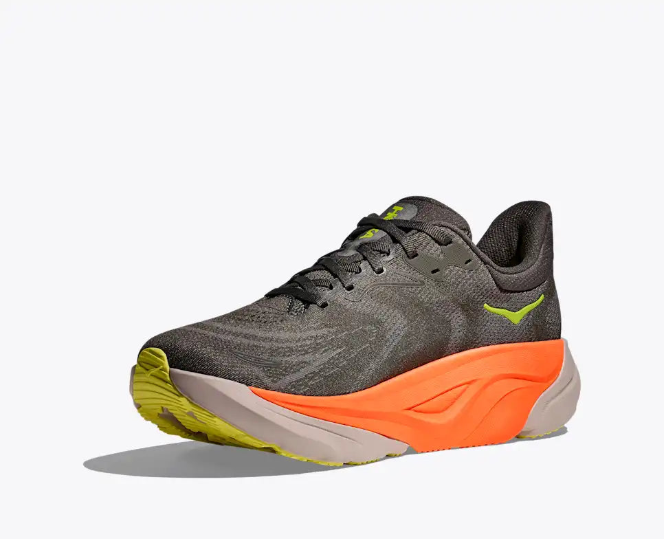 hoka arahi 8 for men, lightweight cushioned running shoe with support to correct overprontaion, dark grey colour with lime green details and orange on sole, angled inside profile of shoe