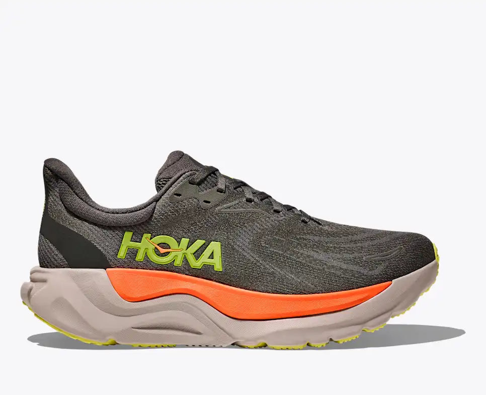 hoka arahi 8 for men, lightweight cushioned running shoe with support to correct overprontaion, dark grey colour with lime green details and orange on sole, side profile of shoe