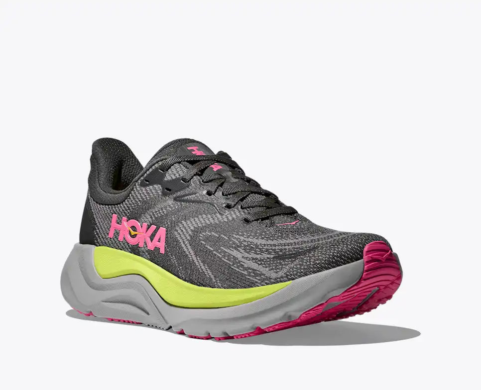 hoka arahi 8 for women, lightweight cushioned support shoe for overpronation when running, dark grey colour with pink details and lime green and grey sole, side angled profile of shoe