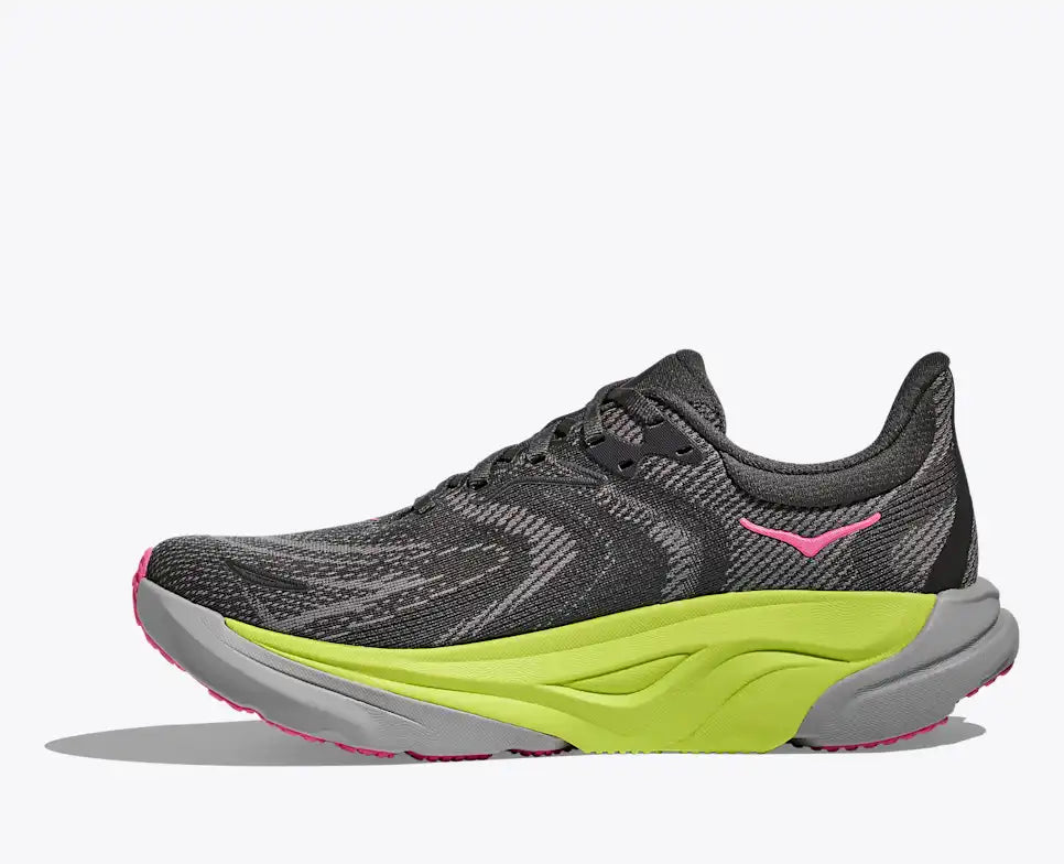 hoka arahi 8 for women, lightweight cushioned support shoe for overpronation when running, dark grey colour with pink details and lime green and grey sole, inside profile of shoe