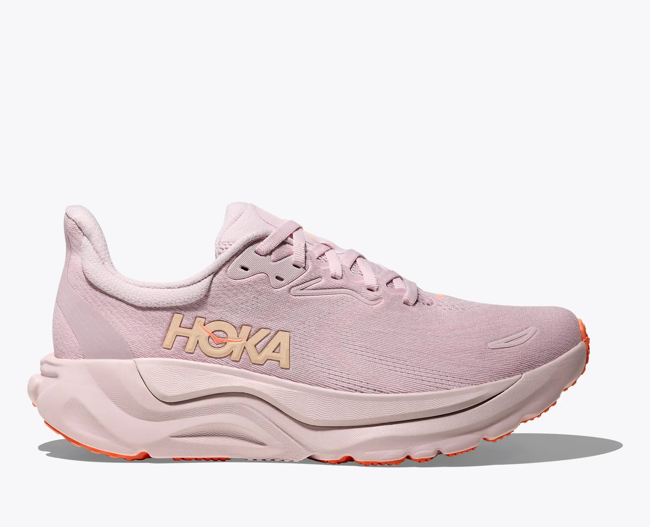 hoka arahi 8 womens, supportive womens running and walking shoe helps with correcting overpronation, light pink colour with orange details under sole, side profile of shoe on white background