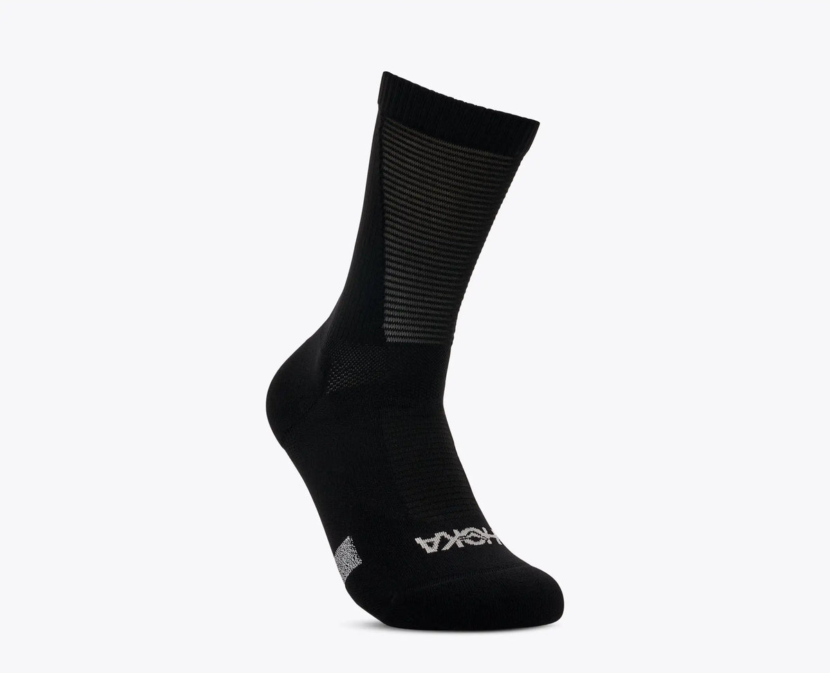 Lightweight race day run sock from Hoka, with breathable mesh panels, black colour, hoka logo at front toe