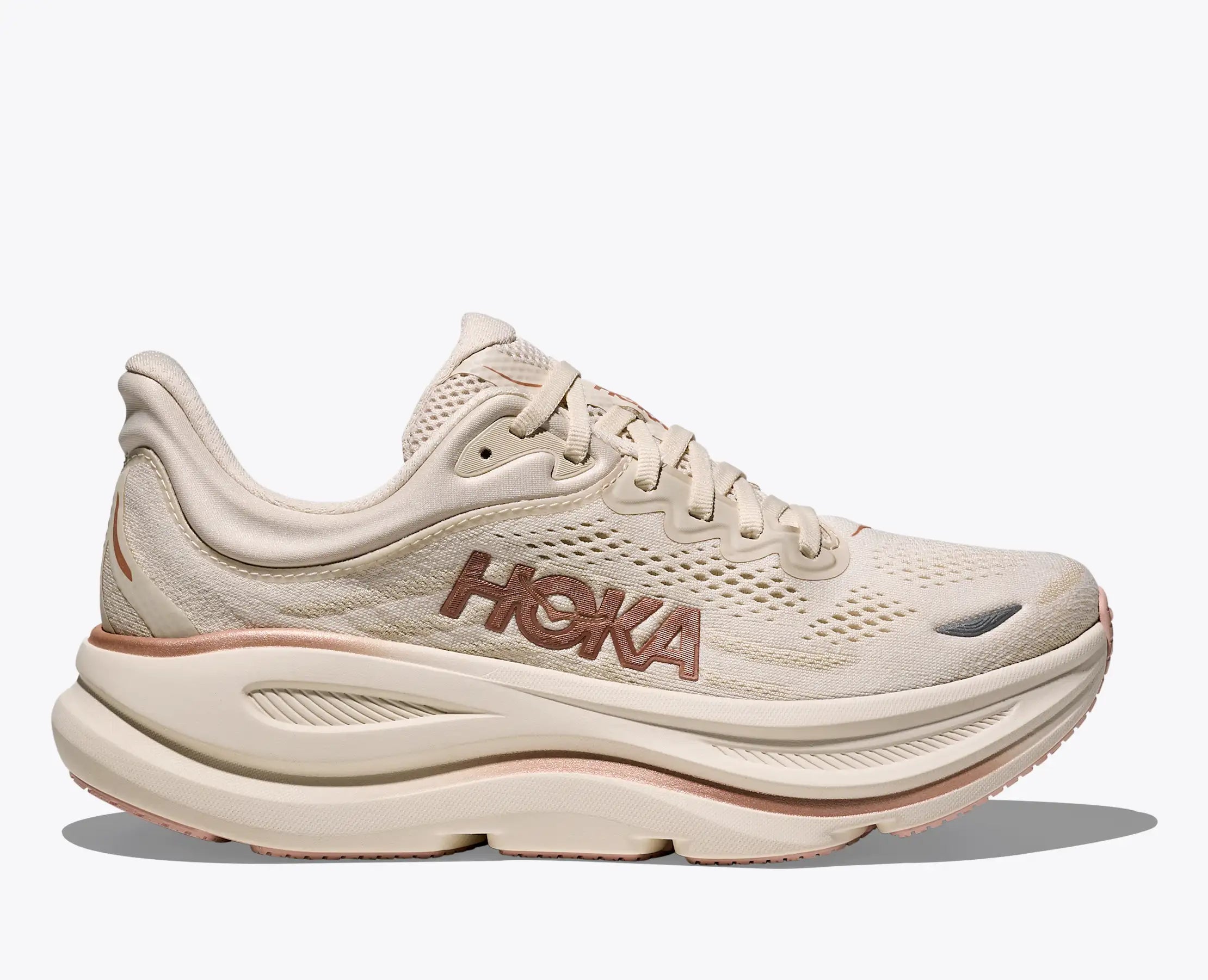 hoka bondi 9 womens, super cushioned road running and walking shoe, white cream colour with rose gold details, side angle of shoe on white background